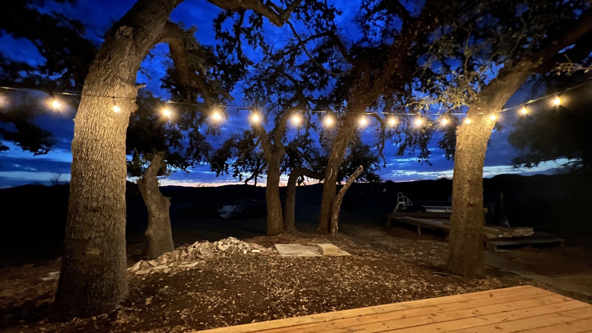 Fire pit under string lights